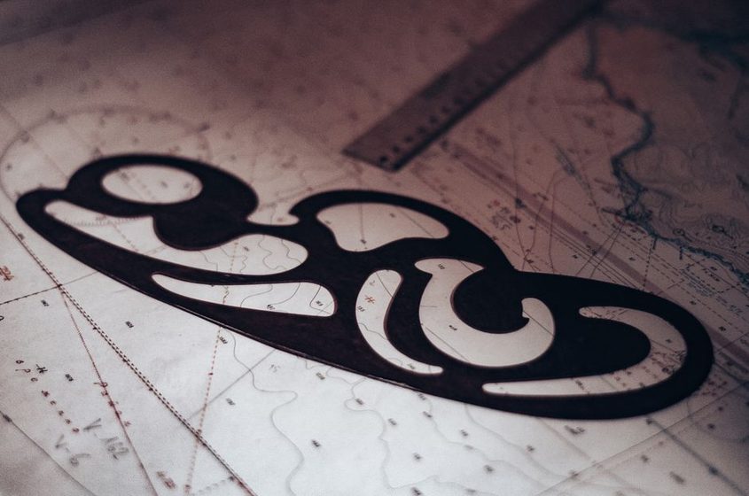 A folded topographic map sheet with contour lines and a pencilled trail route